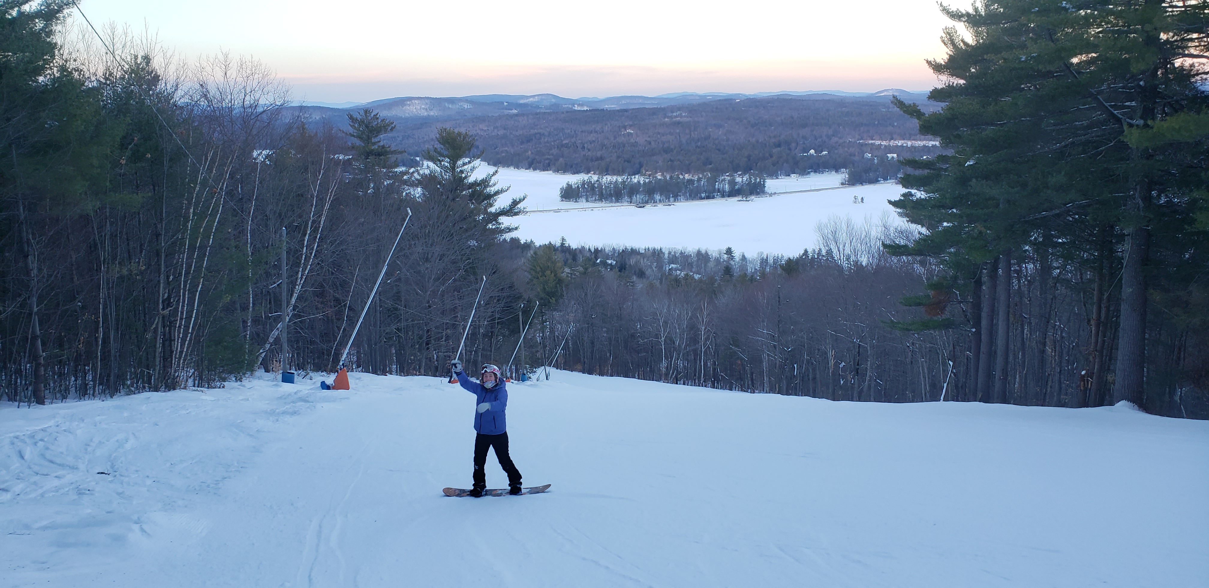 A participant skiing down a snowy trail during Pine Tree Academy's Snowsports program
