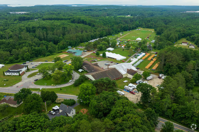 Aerial view of the Pine Tree Academy campus and surrounding woods in Freeport, Maine