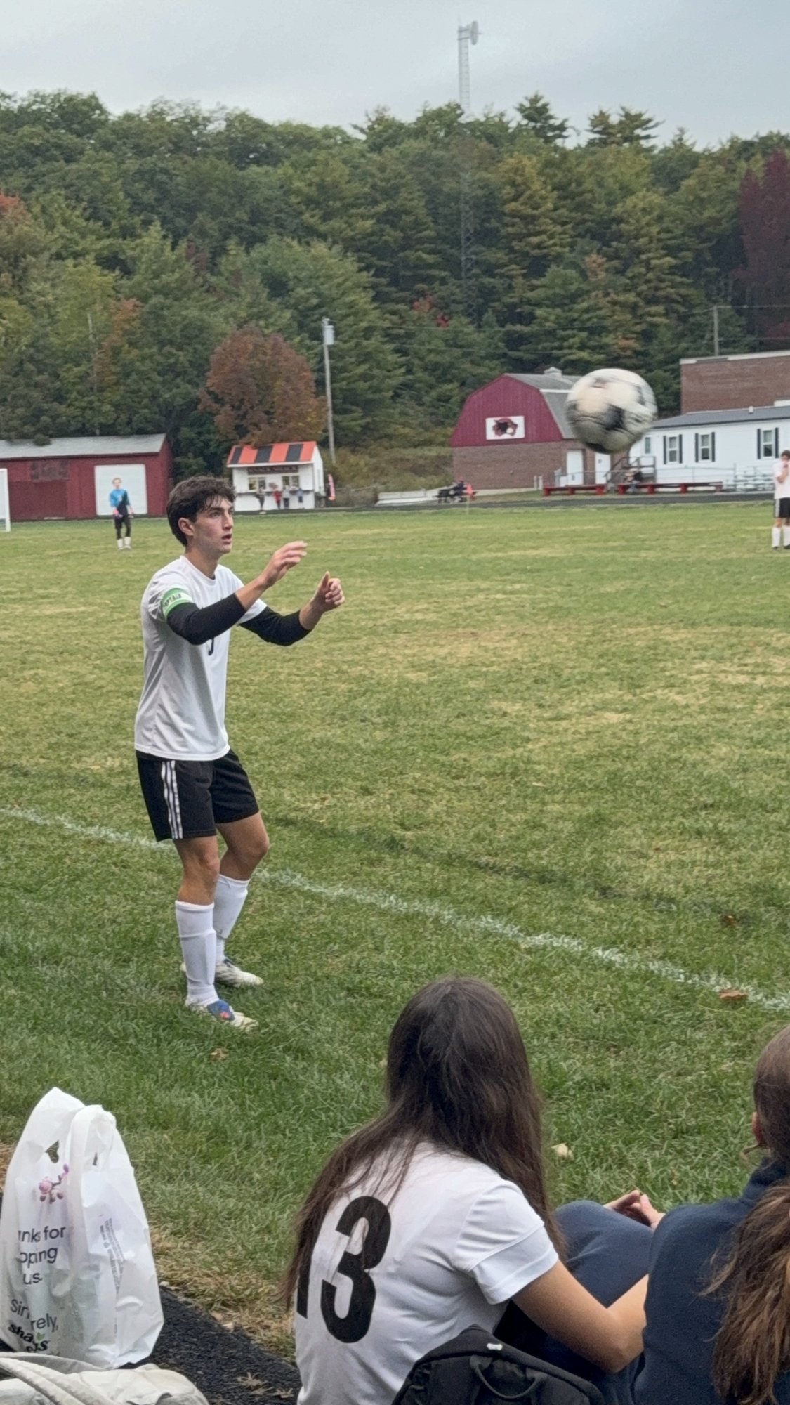 Pine Tree Academy player preparing a throw-in along the sideline during the 6-0 road win at Wiscasset/Boothbay on September 29, 2026