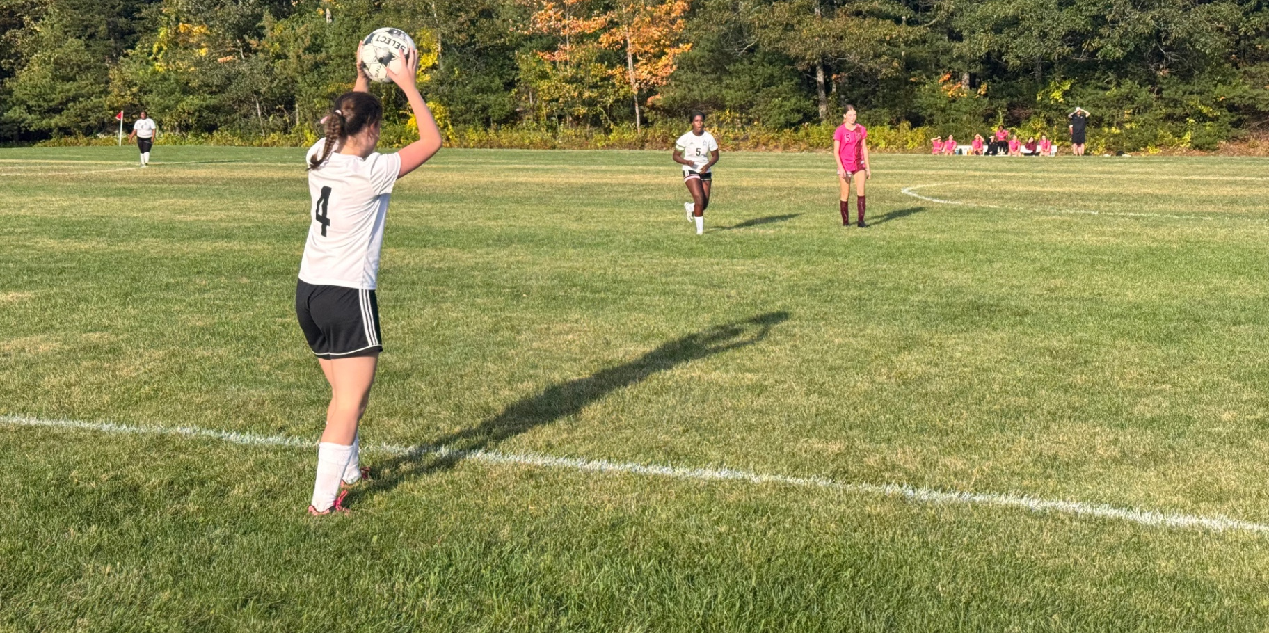 Pine Tree Academy girls varsity soccer player takes a throw-in during the match at Buckfield on October 1, 2026