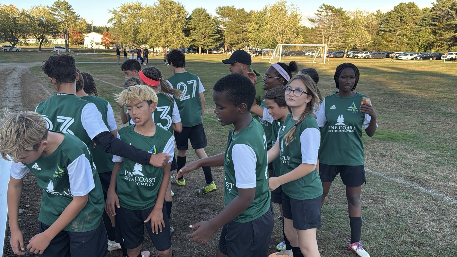 Pine Tree Academy middle school soccer players shaking hands with opponents after a match