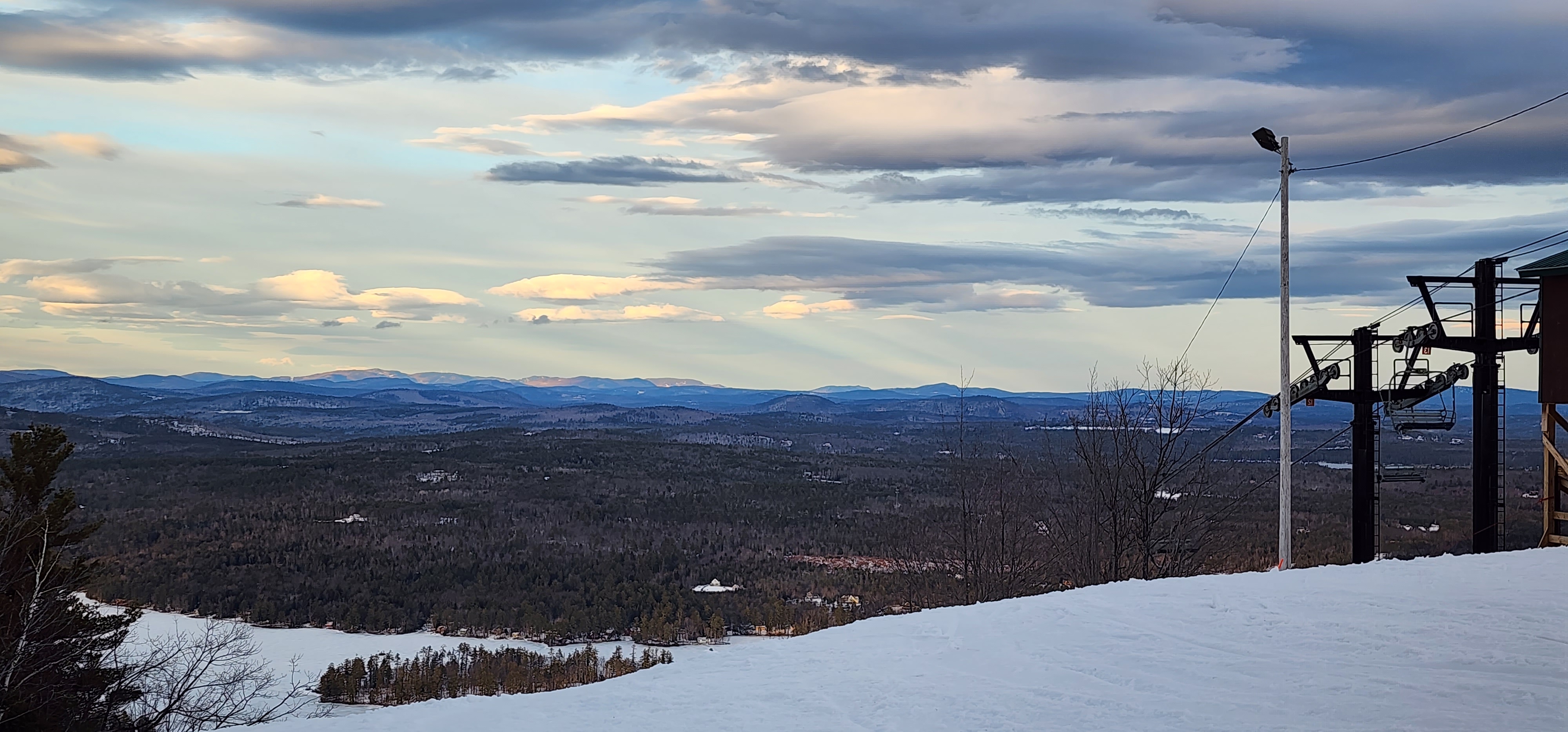 A wide mountain view from a snowy ski trail during the PTA Snowsports program