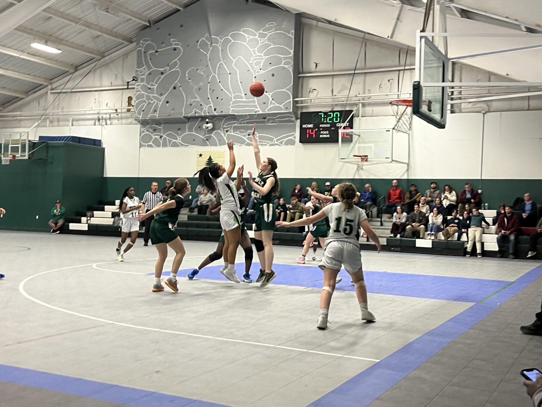 Pine Tree Academy girls varsity basketball player driving toward the basket during a game