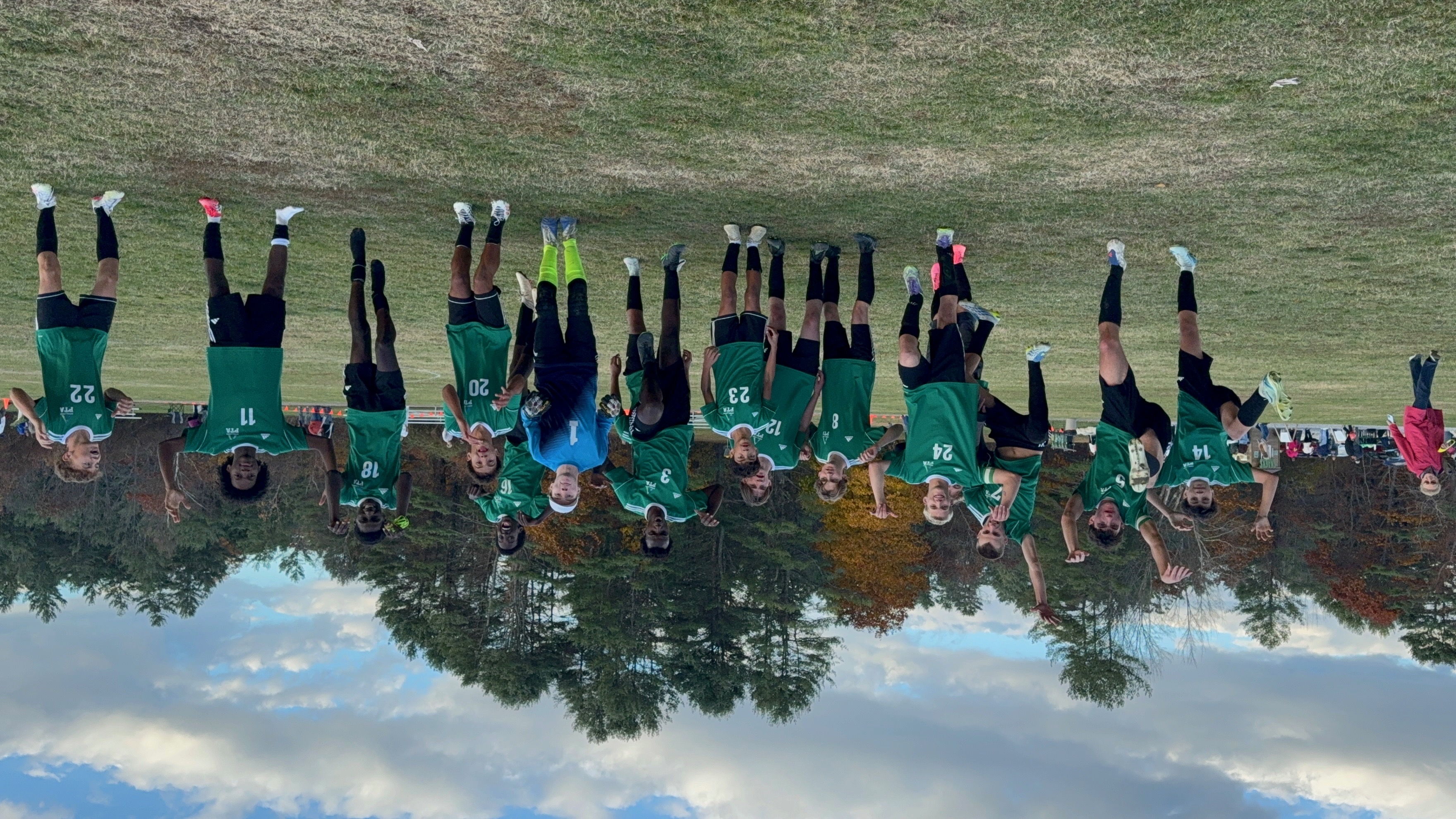 Pine Tree Academy players celebrating together on the field after the Temple Academy regional semifinal