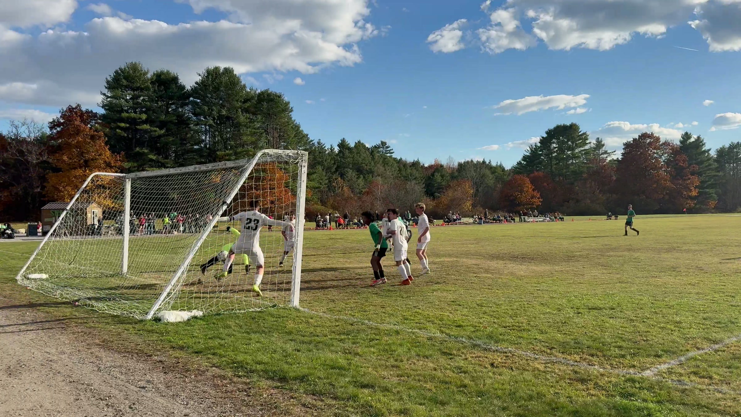 Pine Tree Academy players crowd the Temple Academy goalmouth as the goalkeeper goes down during the 8–0 regional semifinal on October 30, 2026
